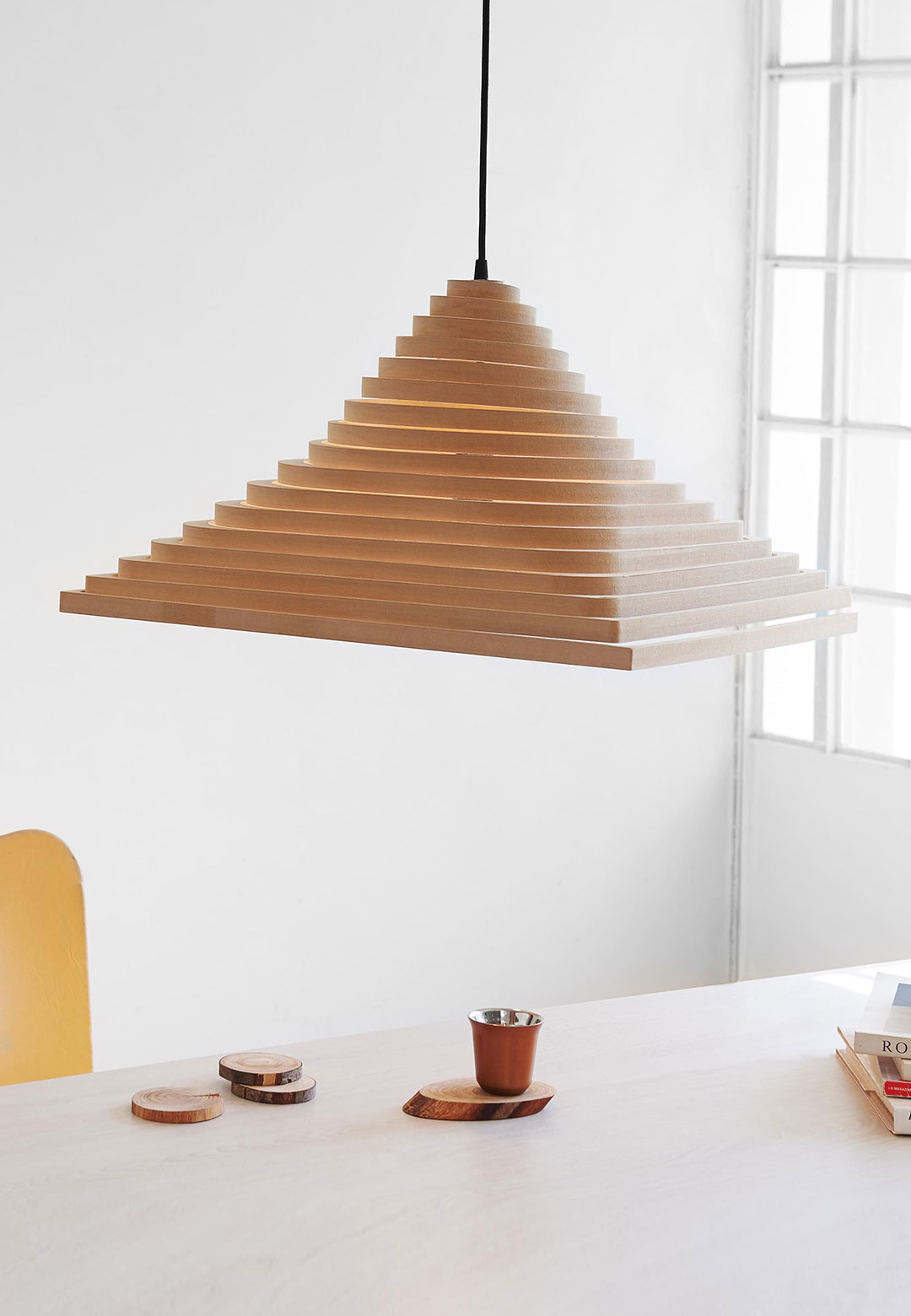 Guillermo Lean’s Spinel is a collapsible pendant light made of plywood