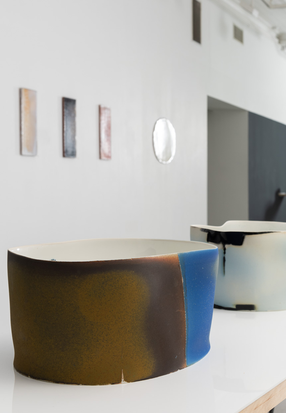 Tray-turned-wall mountings and abstract bowls interact in Format’s ‘heuch & malterud’
