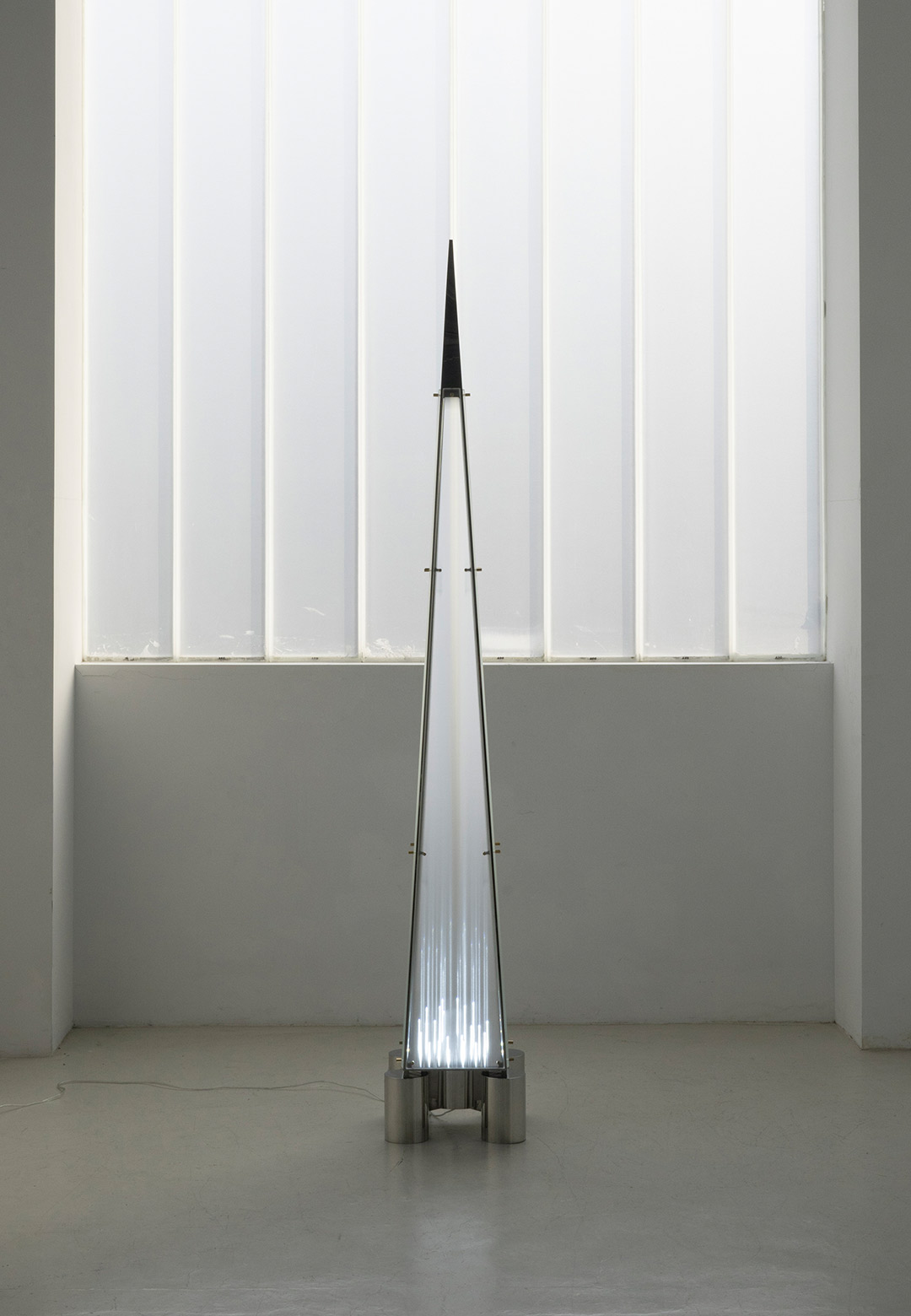 Sing Chan assembles glass fragments for a staggered lighting effect