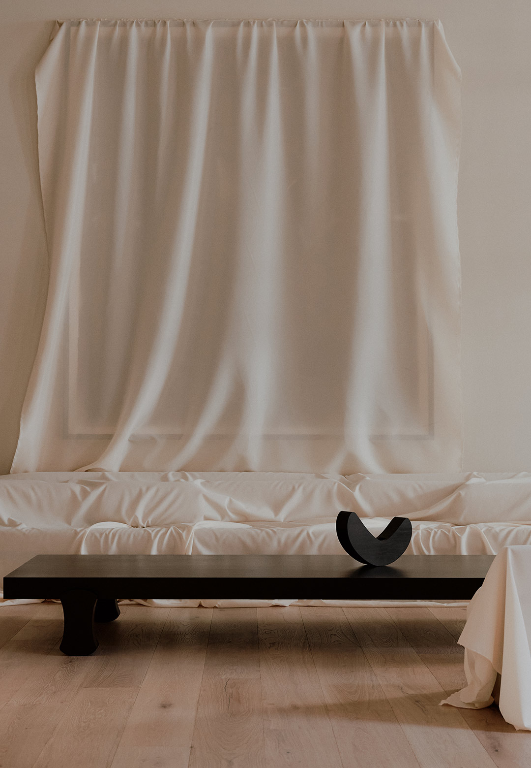 A pall of drop cloth frames Francesco Balzano's 'INIZIO' at STUDIOTWENTYSEVEN
