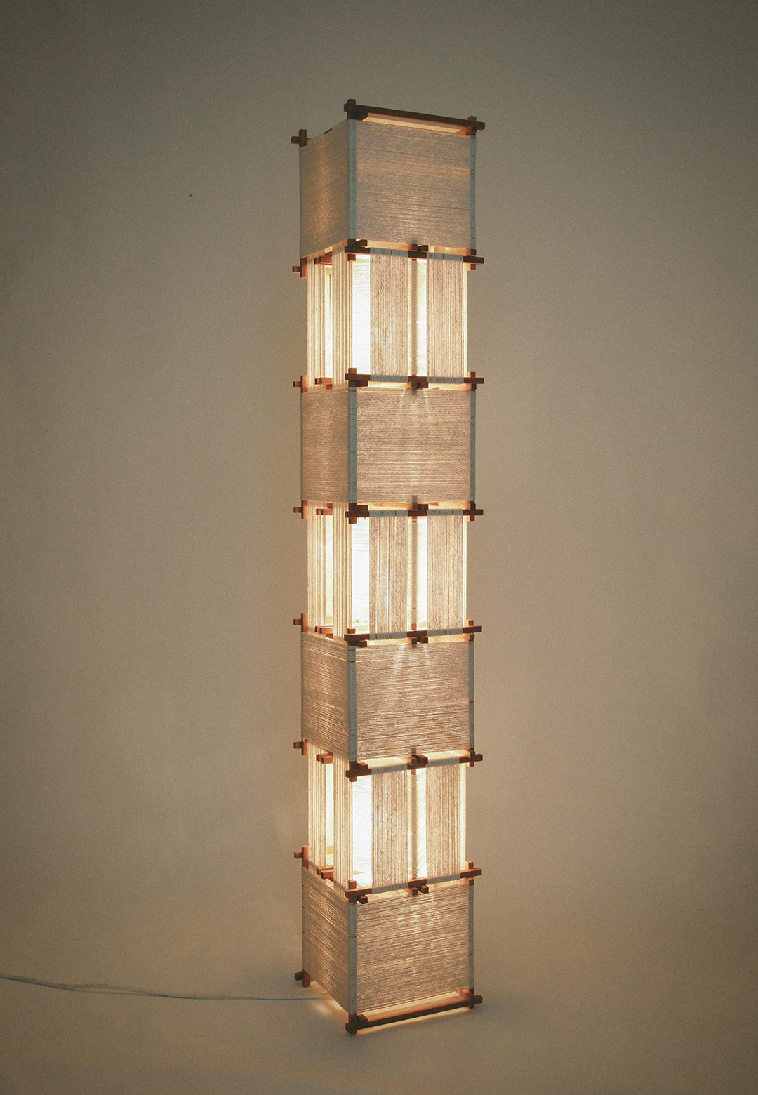 Freddy Tuppen wraps industrial geometric lamps with extended cotton strings