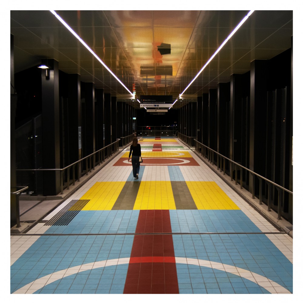 colourful-tiles-inspired-by-20th-century-train-tickets-envelop-hoppers-crossing-walkway