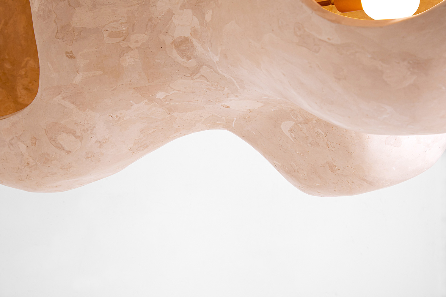 Fluid forms of the pendant lights by Studio AOAO