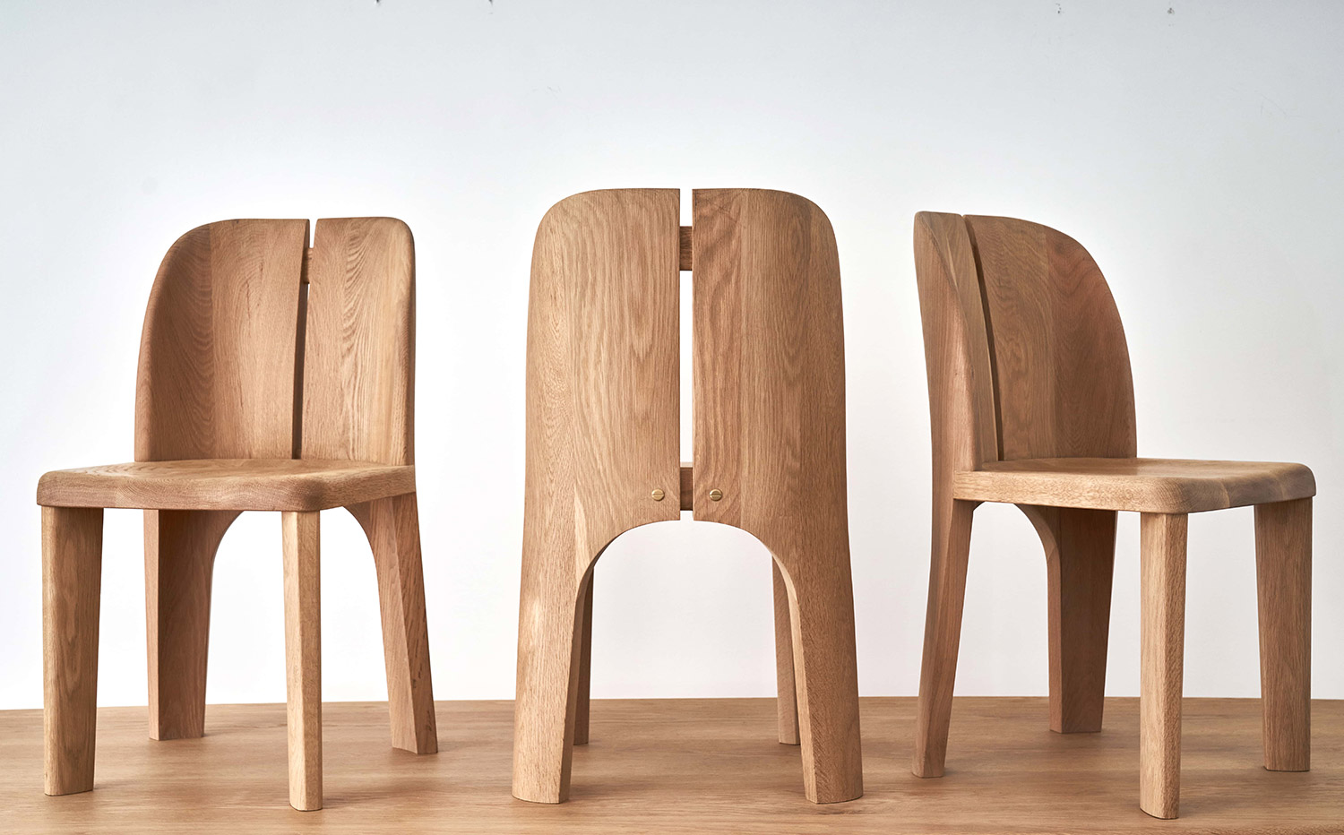 Ovo chairs in old growth white oak soaped with burnished brass hardware