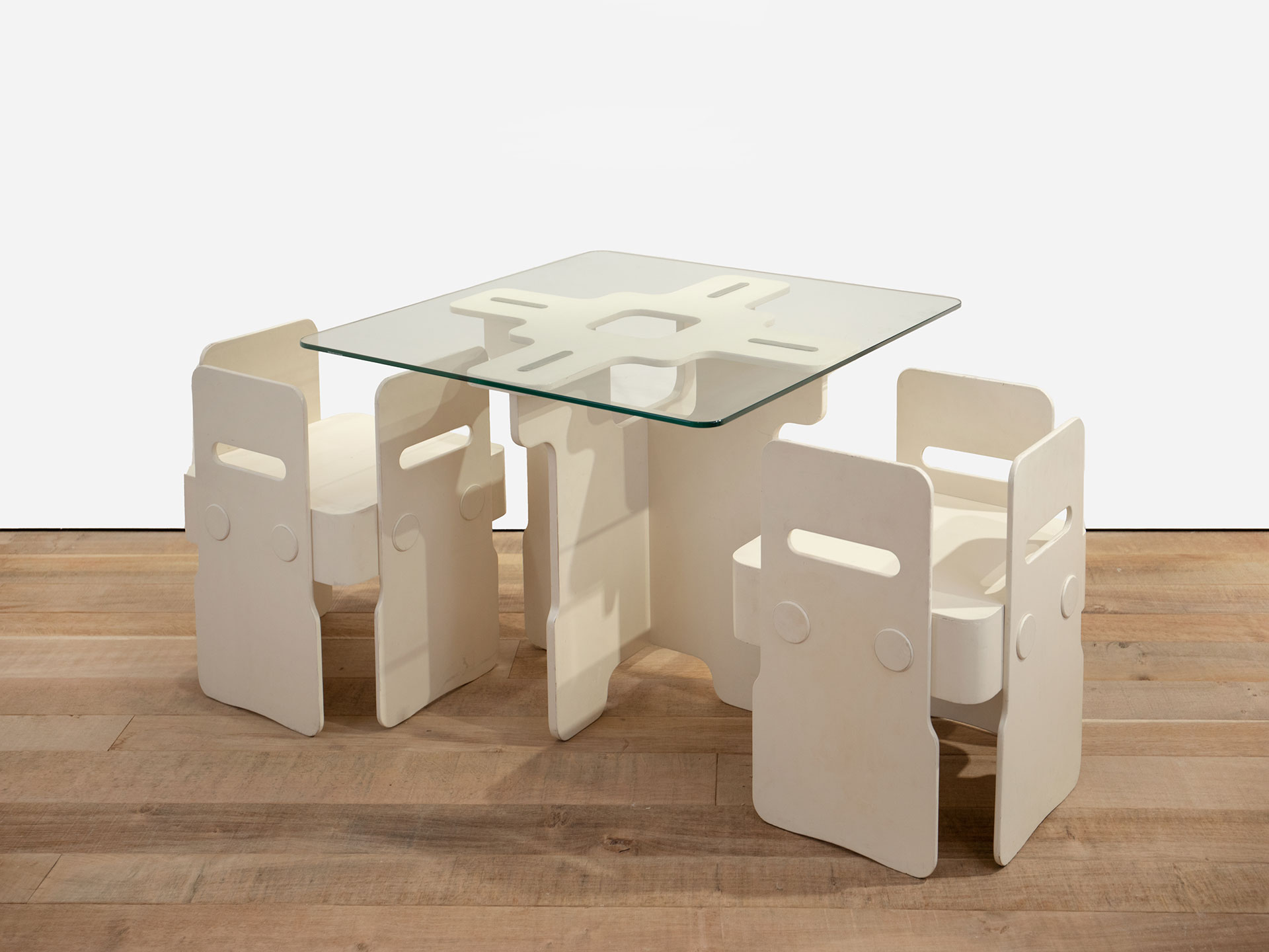 The Sun Table and the Satellite Chairs designed by Max Clendinning