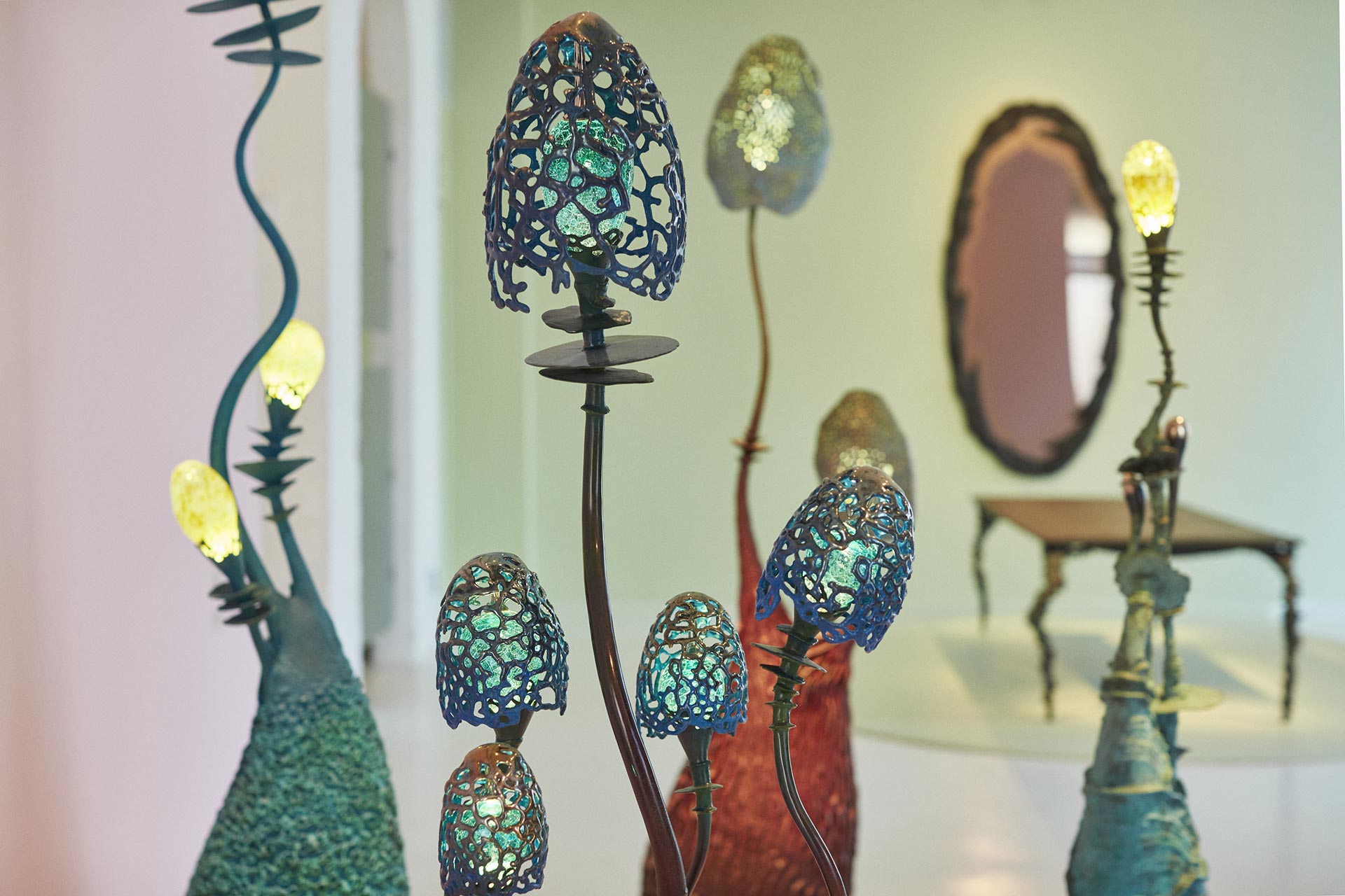 The tentacles holding hand-blown glass bulbs designed by Trzebinski