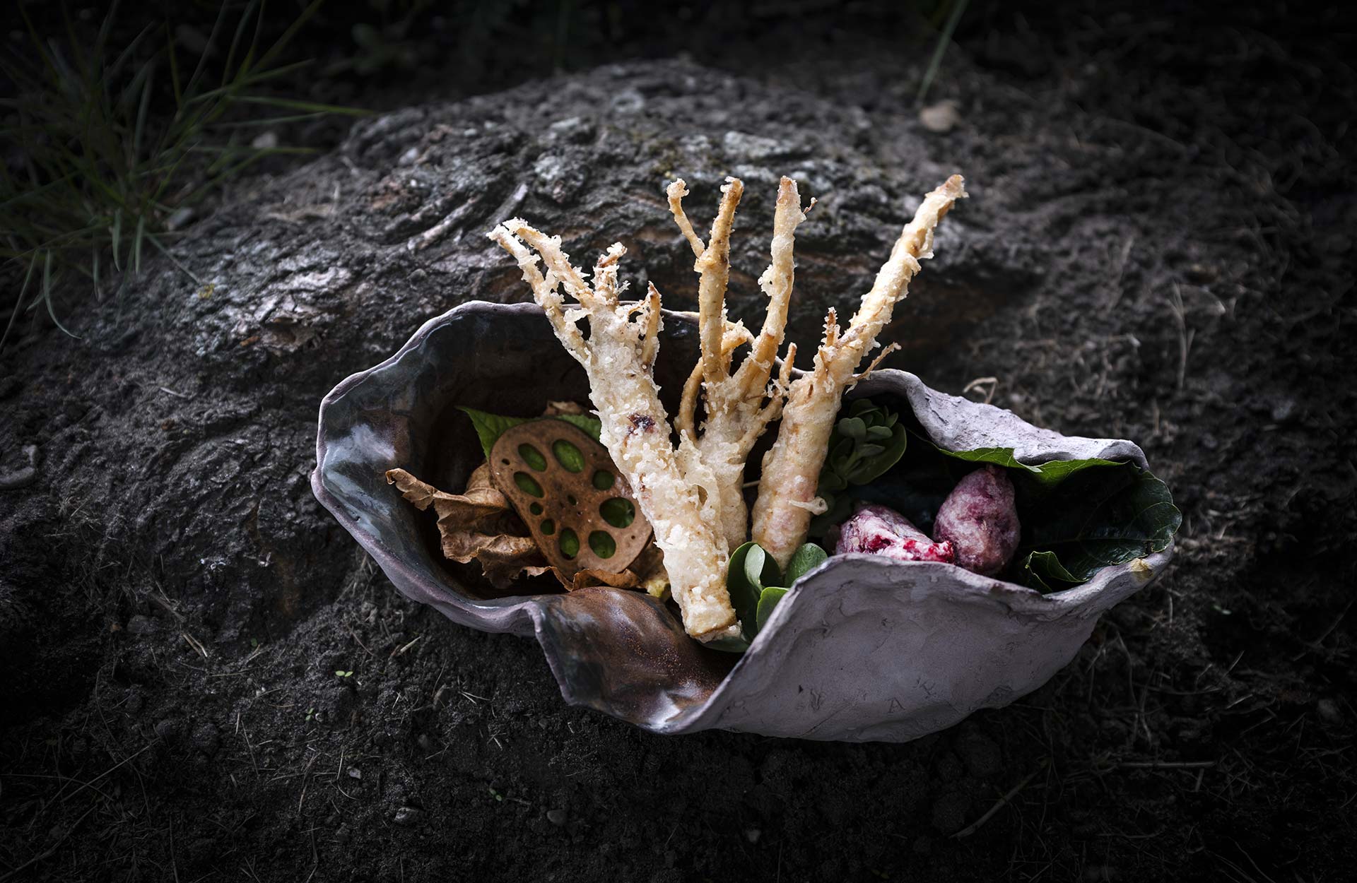 Susam, local beet tuigim, fried fresh ginseng served on a deep shell bowl by Aurore Piette