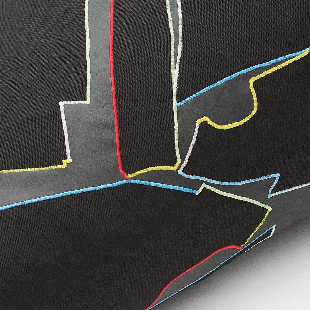 The graphic patterns are derived from offcuts of automotive parts