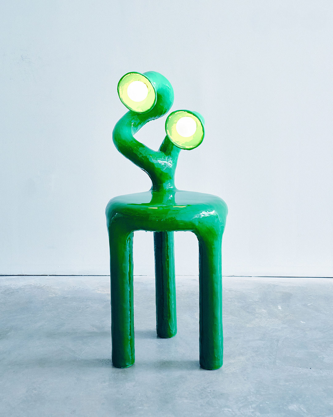 The green two-headed side table lamp