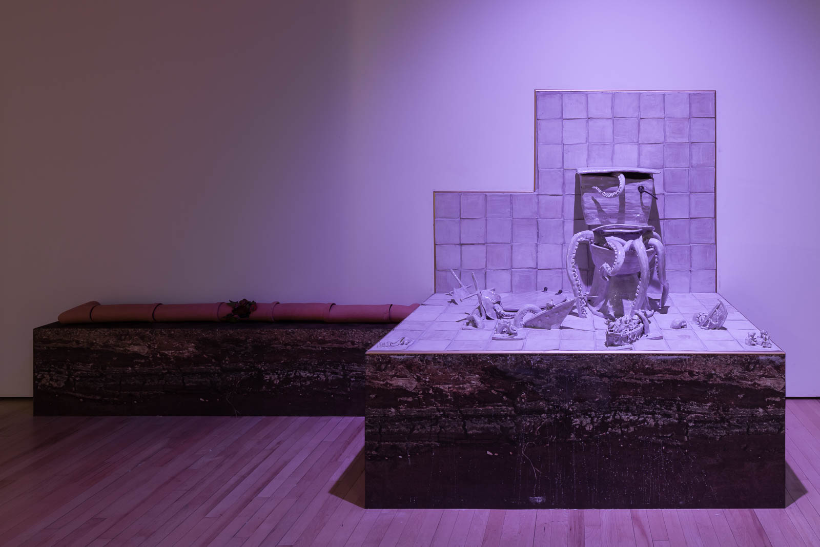 The tentacles of an Octopuss emerging from the toilet in Lindsey Mendick’s installation